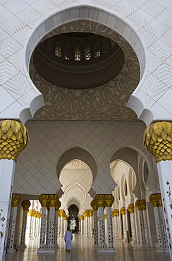 Arches and columns of the courtyard of the new Sheikh Zayed Bin Sultan Al Nahyan Mosque, Grand Mosque, lone figure, Abu Dhabi, United Arab Emirates, Middle East