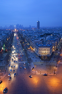 Avenue de la Grande Armee at night with La Defense in the distance from the Arc de Triomphe, Paris, France, Europe