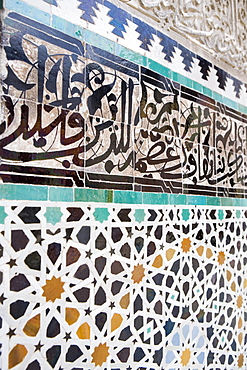 Arabic calligraphy and Zellij tilework, Bou Inania Medersa, Medina, Fez, Morocco, North Africa, Africa