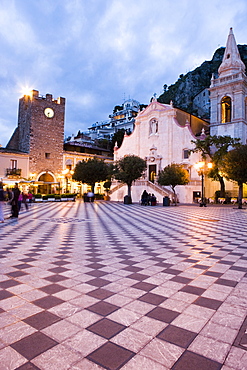 Evening in the Piazza IX Aprile, with the Torre dell Orologio and San Giuseppe church, Taormina, Sicily, Italy, Europe