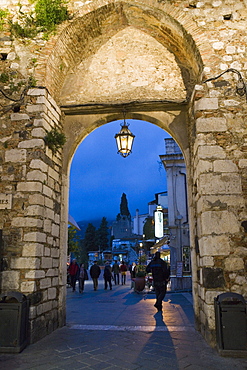 Gateway into town at night, Taormina, Sicily, Italy, Europe