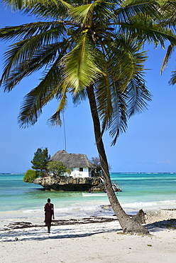 Masai tribesman on Bwejuu Beach, The Rock Restaurant, Zanzibar, Tanzania, Indian ocean, East Africa, Africa