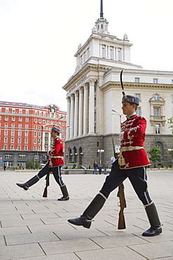 Changing of the Guard at Presidents Building with the Party House in the background, Sofia, Bulgaria, Europe