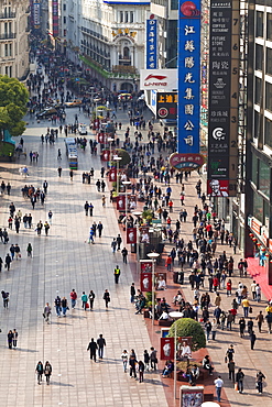 Pedestrians walking past stores on Nanjing Road, Shanghai, China, Asia