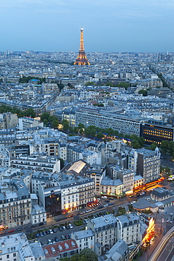 City and Eiffel Tower, viewed over rooftops, Paris, France, Europe