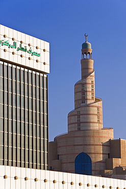 Qatar Central Bank and the spiral mosque of the Kassem Darwish Fakhroo Islamic Centre in Doha based on the Great Mosque in Samarra in Iraq, Doha, Qatar, Middle East