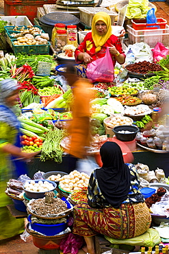 Women selling fruit and vegetables in the town's central market, Kota Bharu, Kelantan State, Malaysia, Southeast Asia, Asia 