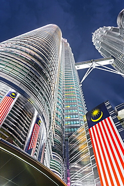 Petronas Towers and Malaysian national flag, Kuala Lumpur, Malaysia, Southeast Asia, Asia