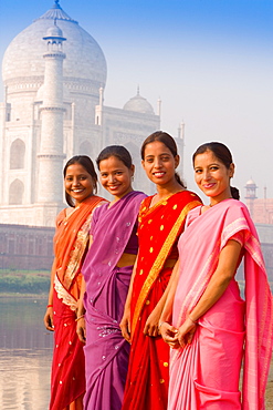 Women in bright saris at the Taj Mahal, UNESCO World Heritage Site, Agra, Uttar Pradesh, India, Asia 