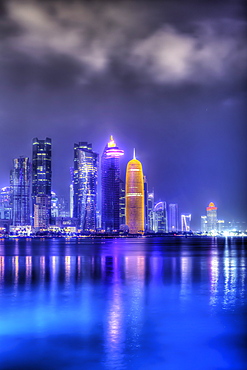 New skyline of the West Bay central financial district of Doha, illuminated at dusk, Qatar, Middle East