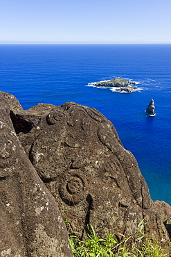 Petroglyphs at the archeological site of Orongo Ceremonial village high on the crater rim of Ranu Kau, Rapa Nui (Easter Island), UNESCO World Heritage Site, Chile, South America