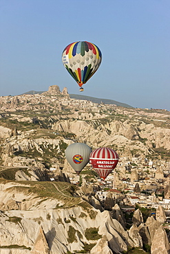 Hot air balloon flight over the famous volcanic tufa rock formations around Goreme, Cappadocia, Anatolia, Turkey, Asia Minor, Eurasia