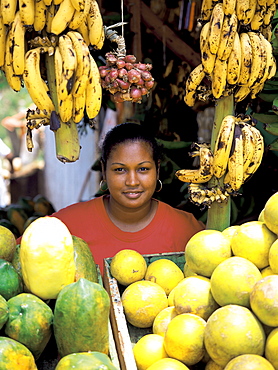 Woman on a fruit stall, Dominican Republic, West Indies, Caribbean, Central America