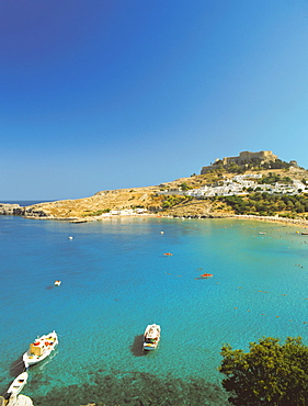 Acropolis overlooking bay, Lindos, Rhodes, Dodecanese, Greek Islands, Greece, Europe