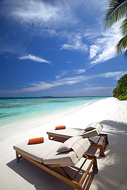 Lounge chairs on tropical beach, Maldives, Indian Ocean, Asia 