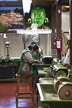 Workers polishing jade at the Casa del Jade (Jade House) Factory and Museum, Antigua, Guatemala, Central America