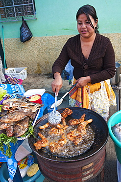 Pollo Campero (fried chicken) in the market at Santiago Sacatepequez, Guatemala, Central America