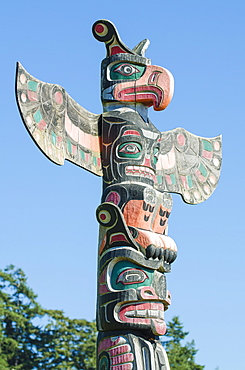 Totem poles in cemetery in Alert Bay, British Columbia, Canada, North America 