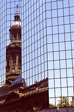 The Metropolitan Cathedral reflected in modern building, Plaza de Armas, Santiago, Chile, South America