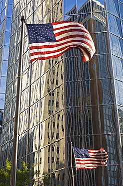 Building reflections and American flag, Oklahoma City, Oklahoma, United States of America, North America