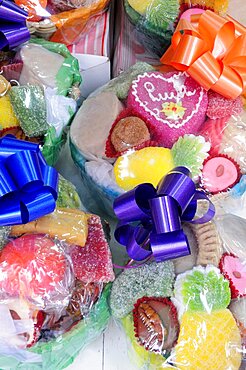 Mexico, Puebla, Colourful sweets wrapped and tied with brightly coloured ribbon.