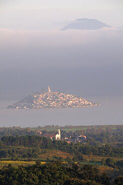 Mexico, Michoacan, Patzcuaro, Early morning misty view of Lago Patzcuaro with Isla Janitzio.