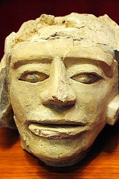 Mexico, Veracruz, Papantla, Carved stone human head 900-1150 AD El Tajin archaeological site museum.