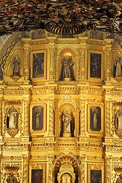 Mexico, Oaxaca, Church of Santo Domingo Interior and carved and gilded altarpiece with paintings and painted sculpted figures.