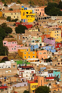 Mexico, Bajio, Guanajuato, Elevated view across brightly painted housing with flat rooftops.