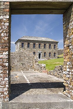 Ireland, County Cork , Kinsale, Charles Fort Museum building seen through the door way of a ruined building built in 1678.