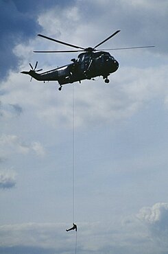 TRANSPORT Air Helicopter Soldier absailing from Sea King helicopter