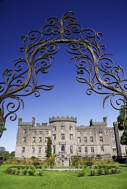 Ireland, County Sligo, Markree, Castle hotel castle and garden viewed through ornamental iron grille.