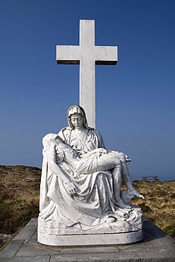 Ireland, County Cork, Sheeps Head Peninsula, Religious staue showing a Calvary scene.