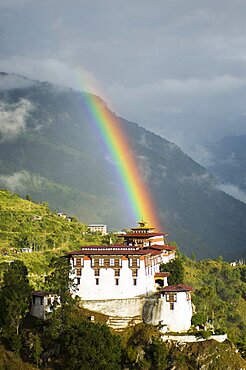 Bhutan, Lhuentse Dzong, Bhutan, Lhuentse Dzong with colourful rainbow overhead.