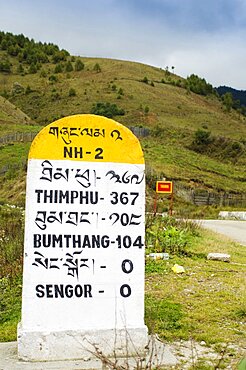 Bhutan, Sengor, Milestones on the side of the main east-west highway showing distances to towns