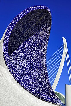 Spain, Valencia Province, Valencia, Spain, Valencia Province, Valencia, La Ciudad de las Artes y las Ciencias, City of Arts and Sciences, An arch of the Umbracle sculpture garden with El Pont de l'Assut de l'Or bridge in the background.