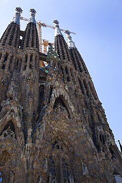 Spain, Catalonia, Barcelona, Eixample, exterior of La Sagrada Familia, designed by Antoni Gaudi.