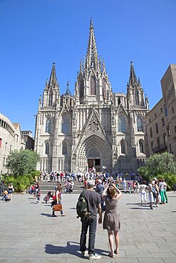 Spain, Catalonia, Barcelona, Tourists outside the Cathedral of the Holy Cross and Saint Eulalia.