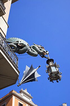 Spain, Catalonia, Barcelona, Dragon sculpture on Building in Placa de la Boqueria on La Rambla.