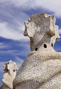 Spain, Catalunya, Barcelona, Antoni Gaudi's La Pedrera building, a section of chimney pots on the roof terrace.