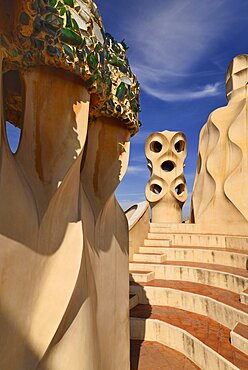 Spain, Catalunya, Barcelona, Antoni Gaudi's La Pedrera building, a section of chimney pots on the roof terrace.