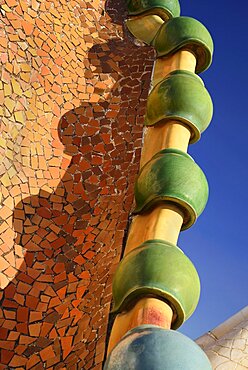 Spain, Catalunya, Barcelona, Antoni Gaudi's Casa Batllo building, detail of dragon's back feature on the roof terrace.