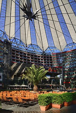 Germany, Berlin, Potzdamer Platz, Sony Centre with glass canopied roof over its central plaza.