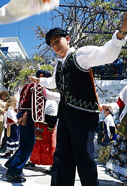 GREECE Cyclades Islands Amorgos Langada. Boy in costume performing traditional Greek dancing