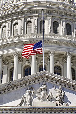 USA, Washington DC, Capitol Building, Section of the building's dome with the American flag at half mast.