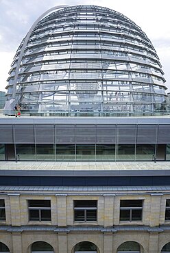 Germany, Berlin, Mitte, Tiergarten, exterior of the glass dome on the top of the Reichstag building designed by architect Norman Foster with a double-helix spiral ramp around the mirrored cone that reflect light into the debating chamber of the Bundestag below.