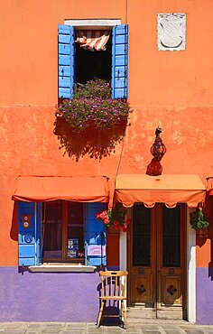 Italy, Veneto, Burano Island, Colourful row of house facades.