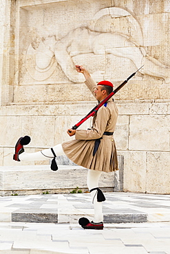 Greece, Attica, Athens, Greek soldier, an Evzone, beside Tomb of the Unknown Soldier, outside Parliament building.