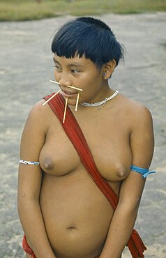 Portrait of Yanomami woman with facial piercings, Amazon, Roraima, Brazil