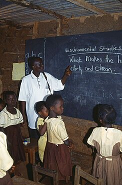 GHANA West Education Teacher and children in primary school studying environmental issues.